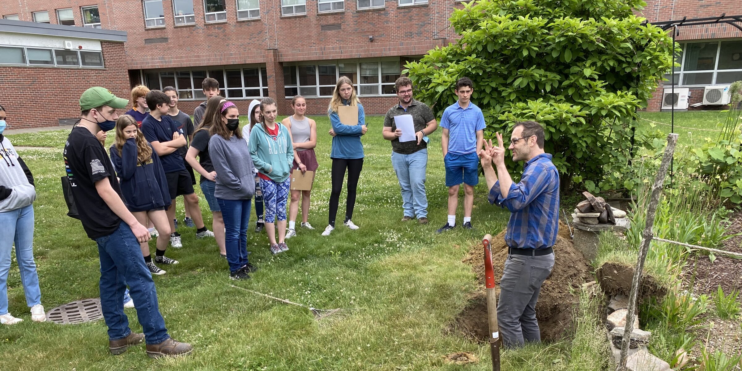 RDG's Keith Zaltzberg demonstrating soil testing for Deerfield high school students