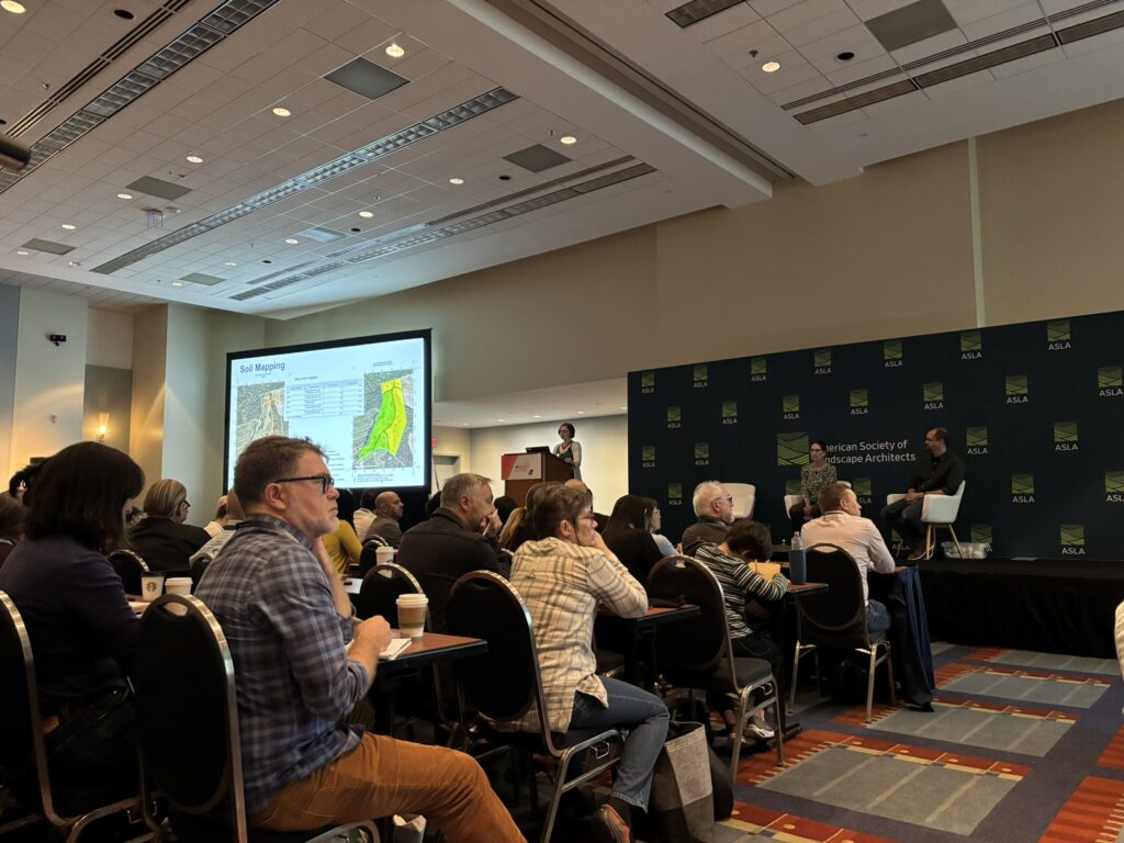 Rachel Lindsay at a podium, presenting a slide during Unlocking the Carbon Potential of Soils session