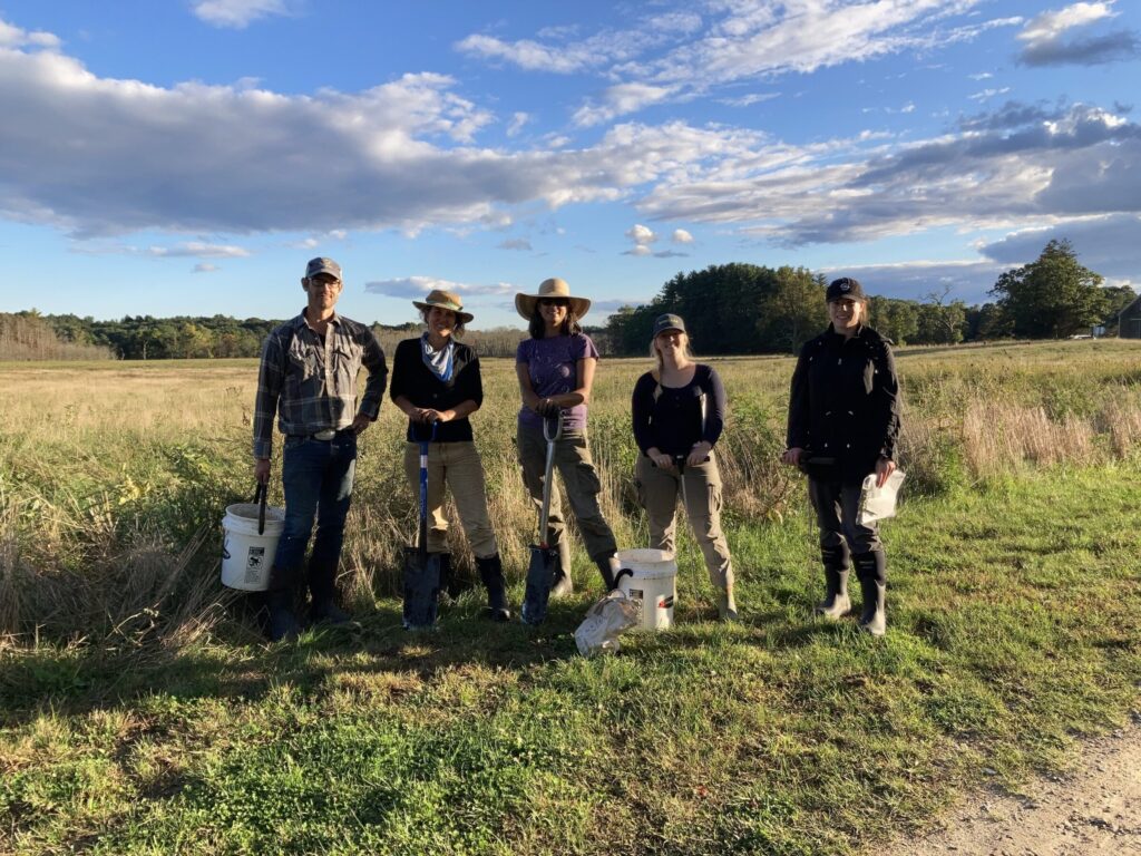 Keith, Steph, Caro, Miriam, and Molly pose on their way to sampling soil